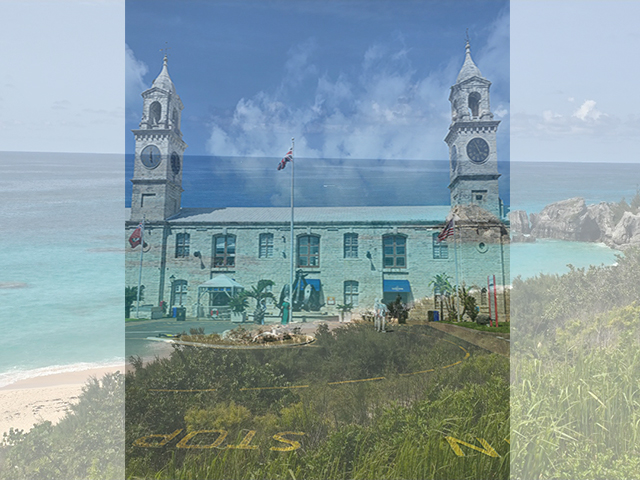 Photo of Royal Naval Dockyard and a beach faded in the background