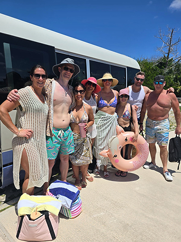 Photo of a tour group of people at the beach